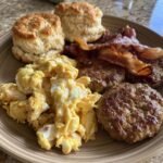 Healthy Breakfast Plate with Sausage Patties, Scrambled Eggs,Bacon, and Biscuits