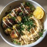 Healthy Crispy Brussels Sprouts Grain Bowl with Hummus and Tahini
